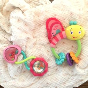 Baby rattles as car seat toys to keep baby happy in the car