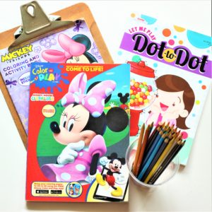 Colored pencils and books for car seat toys