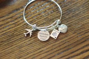 Charms taken from key chain to decorate money jar
